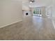 Spacious living area with fireplace and access to the patio at 4934 Samoa Cir # 7, Orlando, FL 32808