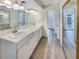Bathroom with double vanity and view into another room at 4934 Samoa Cir # 7, Orlando, FL 32808