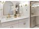 Elegant bathroom with double vanity, gold fixtures, and large shower at 1317 Noble St, Longwood, FL 32750