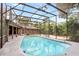 Inviting screened-in pool perfect for relaxation and entertainment at 1317 Noble St, Longwood, FL 32750