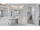 Double vanity bathroom with a large mirror and access to another room at 12337 Greco Dr, Orlando, FL 32824