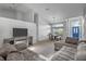 Open living space with L-shaped sectional sofa and dining area at 12337 Greco Dr, Orlando, FL 32824