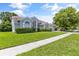 House exterior featuring a well-maintained lawn and landscaping at 12337 Greco Dr, Orlando, FL 32824