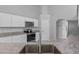 Modern kitchen with stainless steel appliances and granite countertops at 12337 Greco Dr, Orlando, FL 32824