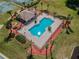 Community pool with surrounding landscaping at 12337 Greco Dr, Orlando, FL 32824