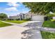 House exterior showcasing a driveway and attached garage at 12337 Greco Dr, Orlando, FL 32824