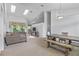 Dining area with a farmhouse table and bench seating at 12337 Greco Dr, Orlando, FL 32824