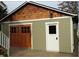 Rustic-style detached garage with double doors and side entry at 925 14Th St, Saint Cloud, FL 34769