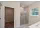 Bathroom with walk-in shower, closet, and modern vanity at 34 Dogwood Dr Crse, Ocala, FL 34472