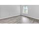 Simple bedroom with grey walls and wood-look floors at 2384 Sun Valley Cir, Winter Park, FL 32792