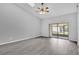 Spacious living room with sliding glass doors leading to the patio at 2384 Sun Valley Cir, Winter Park, FL 32792