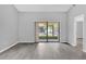 Living room with vinyl flooring and sliding glass doors at 2384 Sun Valley Cir, Winter Park, FL 32792