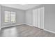 Bedroom with grey walls, wood-look floors and double door closet at 2384 Sun Valley Cir, Winter Park, FL 32792