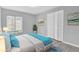 Main bedroom with grey walls, wood-look floors, and double door closet at 2384 Sun Valley Cir, Winter Park, FL 32792