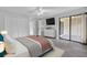 Main bedroom with walk-in closet and sliding doors to patio at 2384 Sun Valley Cir, Winter Park, FL 32792