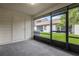 Screened patio with access to backyard and storage closet at 2384 Sun Valley Cir, Winter Park, FL 32792