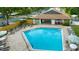 Community pool with surrounding lounge chairs and patio area at 2384 Sun Valley Cir, Winter Park, FL 32792
