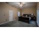 Main bedroom with double doors leading to a balcony at 16600 Cleveland Ln, Umatilla, FL 32784