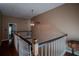 Upper floor hallway with hardwood floors and ceiling fan at 16600 Cleveland Ln, Umatilla, FL 32784
