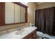 Clean bathroom with a marble countertop and a shower/tub combo at 16600 Cleveland Ln, Umatilla, FL 32784