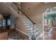 Elegant staircase with white spindles and ornate detailing at 16600 Cleveland Ln, Umatilla, FL 32784