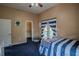 Bright bedroom with a walk-in closet and a view of the backyard at 16600 Cleveland Ln, Umatilla, FL 32784