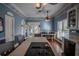 Spacious kitchen with island, cooktop, and hardwood floors at 16600 Cleveland Ln, Umatilla, FL 32784