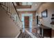 Grand entryway with hardwood floors, staircase, and antique console table at 16600 Cleveland Ln, Umatilla, FL 32784