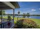 Enjoy serene water views from this home's porch at 16600 Cleveland Ln, Umatilla, FL 32784