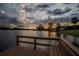 Wooden dock overlooking a calm lake at sunset at 16600 Cleveland Ln, Umatilla, FL 32784