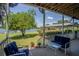 Relaxing porch overlooking lake with seating area at 16600 Cleveland Ln, Umatilla, FL 32784