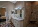 Bathroom with double sinks, walk in shower, and linen closet at 16600 Cleveland Ln, Umatilla, FL 32784