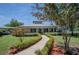 Charming one-story home with landscaped yard and walkway at 16600 Cleveland Ln, Umatilla, FL 32784