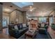 Bright living room features a vaulted ceiling, comfy seating, and an open floor plan at 16600 Cleveland Ln, Umatilla, FL 32784