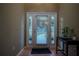 Bright entryway with tile flooring and a console table at 16600 Cleveland Ln, Umatilla, FL 32784