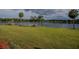 Spacious grassy lakefront lot with private dock and lush landscaping at 16600 Cleveland Ln, Umatilla, FL 32784
