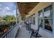 Relaxing front porch with rocking chairs overlooking the property at 16600 Cleveland Ln, Umatilla, FL 32784