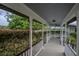 Long covered walkway/porch with railings at 16600 Cleveland Ln, Umatilla, FL 32784