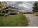Two story house and guest house view at 16600 Cleveland Ln, Umatilla, FL 32784