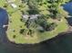 Lakefront property with expansive yard and outbuildings at 16600 Cleveland Ln, Umatilla, FL 32784