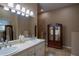 Double vanity bathroom with a large walk-in shower at 16600 Cleveland Ln, Umatilla, FL 32784