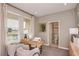 Cozy home office with a desk, two chairs, and a view of a small bathroom at 1227 Teal Creek Dr, Saint Cloud, FL 34771