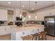 Modern kitchen with white cabinets, stainless steel appliances, and a large island at 1227 Teal Creek Dr, Saint Cloud, FL 34771
