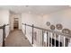 Upstairs hallway with railing overlooking the main floor at 1227 Teal Creek Dr, Saint Cloud, FL 34771