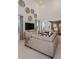 Bright living room featuring a large sectional sofa and high ceilings at 1227 Teal Creek Dr, Saint Cloud, FL 34771