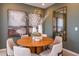 Charming dining area with round wooden table and modern chairs at 1227 Teal Creek Dr, Saint Cloud, FL 34771