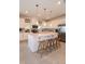 Modern kitchen with white cabinets, center island and stainless steel appliances at 1227 Teal Creek Dr, Saint Cloud, FL 34771