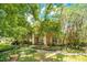 Two-story brick home with a covered porch and lush landscaping at 1650 Lakehurst Ave, Winter Park, FL 32789
