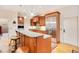 Kitchen boasts a breakfast bar, granite countertops, and stainless steel appliances at 1650 Lakehurst Ave, Winter Park, FL 32789