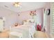 Charming bedroom with white furniture, a plush rug, and a peaceful atmosphere at 1650 Lakehurst Ave, Winter Park, FL 32789